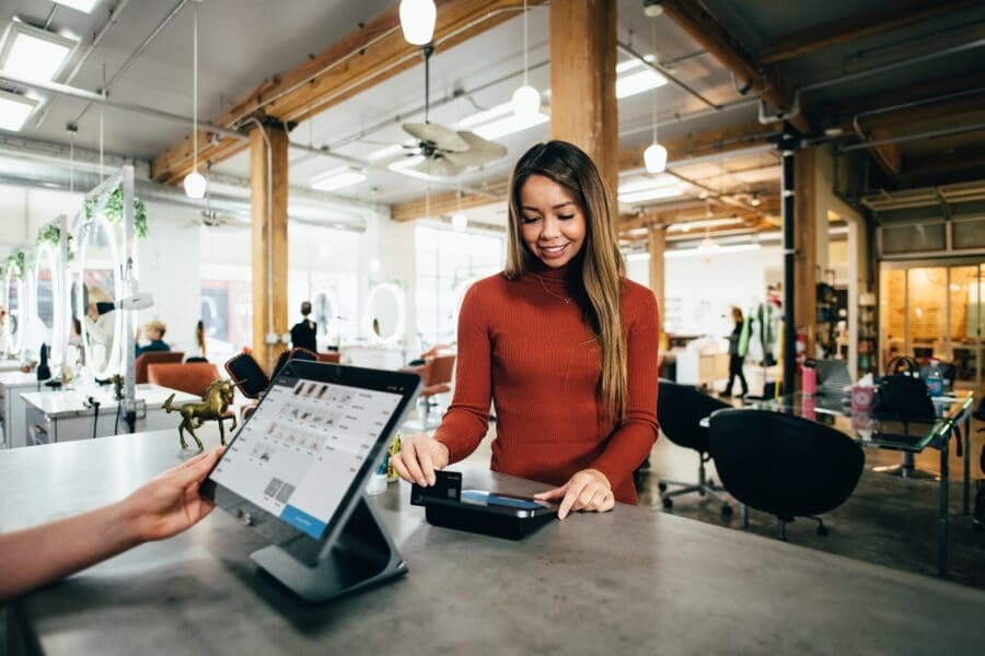 Woman Checking Out At Register