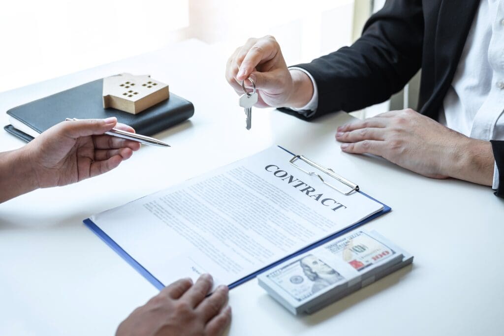 What is the Real Timeline for Purchasing a House? Real estate agent reviewing contract with client.