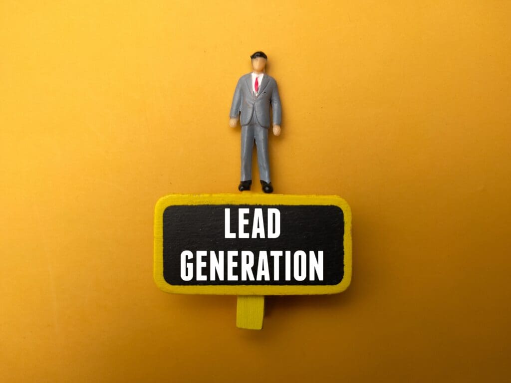 Miniature people and wooden board with the word Lead Generation - Real-Estate-Leads How to Expand Your Real Estate Business and Attract More Clients: Lead Generation
