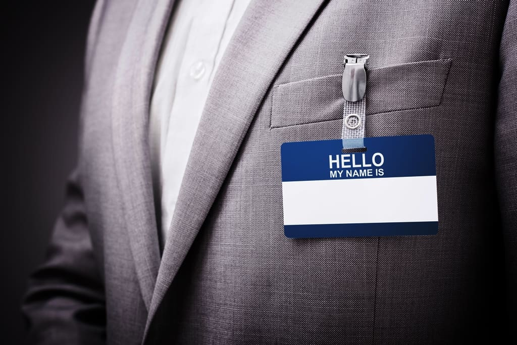 Businessman wearing Hello my name is tag - Real-Estate-Leads Ways to Show Appreciation for Your Professional Network: Networking events