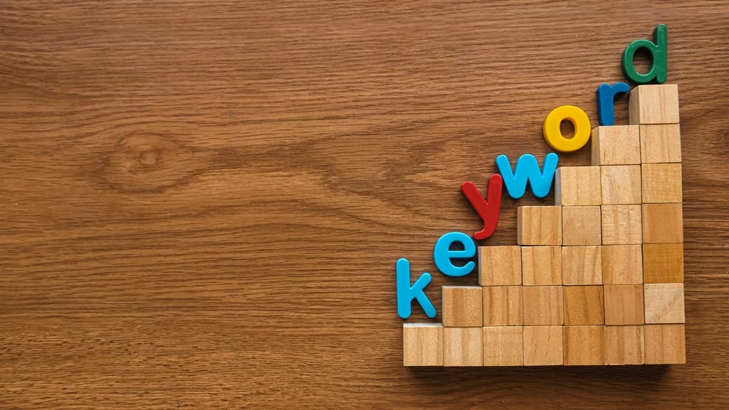 colorful-alphabet-of-word-keyword-on-a-ladder-of-w-2022-11-17-16-48-55-utc-1 - Real-Estate-Leads A Comprehensive SEO Guide for Real Estate Agents: Keywords