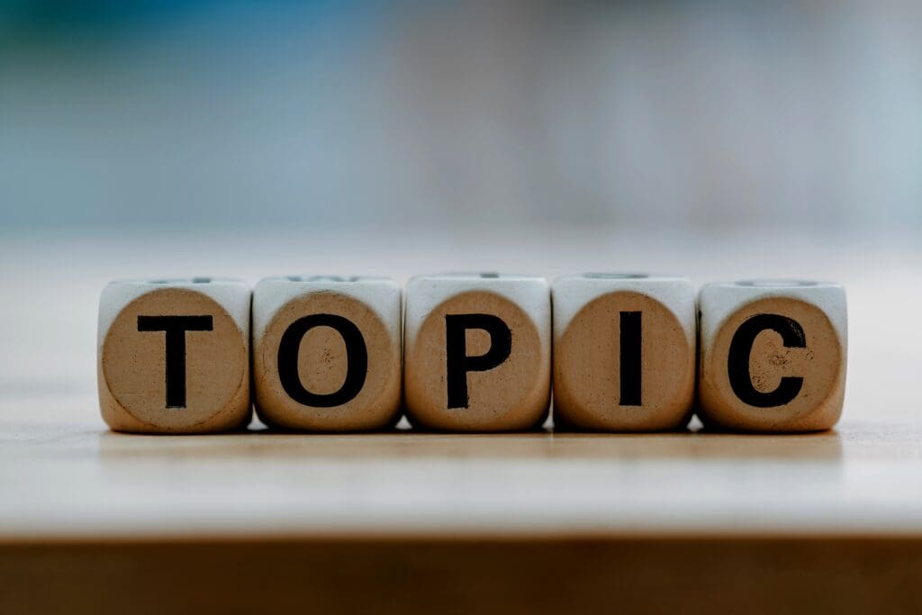 TOPIC concept with wooden block on wooden table background. - Real-Estate-Leads Hosting Educational Webinars: An Expert Guide for Real Estate Agents: Tropics