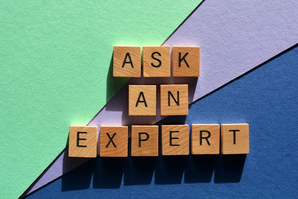 Ask An Expert, words in wood alphabet letters isolated on colorful background - Real-Estate-Leads Business Taxes: A Comprehensive Guide for Real Estate Agents: Professional Guidance
