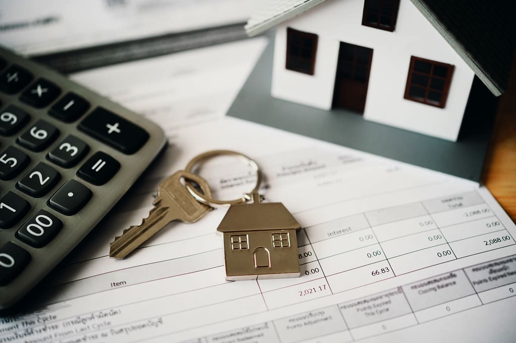 model-of-house-placed-on-contract-placed-on-a-wood-2023-11-27-05-29-38-utc - Real-Estate-Leads What Is Escrow In Real Estate Transactions? The Escrow Process