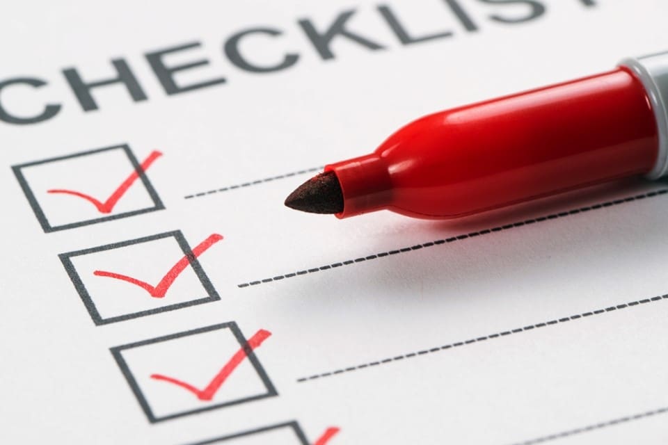 Red marker pen marking on checklist box close up - Real-Estate-Leads How to Qualify Leads: A Comprehensive Guide for Agents: Identify Characteristics