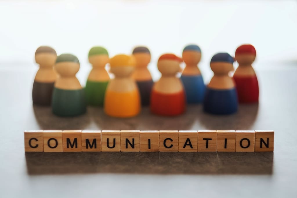 COMMUNICATION word on wooden blocks with a group of people in the background - Real-Estate-Leads What If Your Buyer Isn't Qualified? Advice for Real Estate Agents: Communication