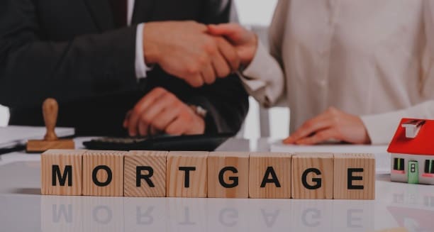 cropped-view-of-businessman-and-businesswoman-shak-2023-11-27-04-59-50-utc - Real-Estate-Leads How to Encourage Clients to Get Loan Pre-Approval: Trusted Partners